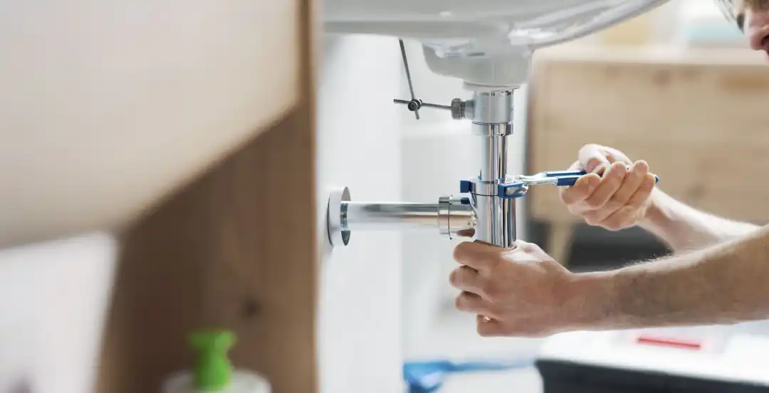 S&S Mechanical plumber repairing a sink drain in Sparks, NV